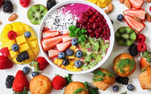 bowl full of different, colorful types of fruit