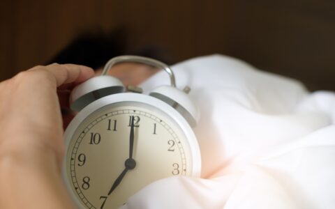 alarm clock on bed