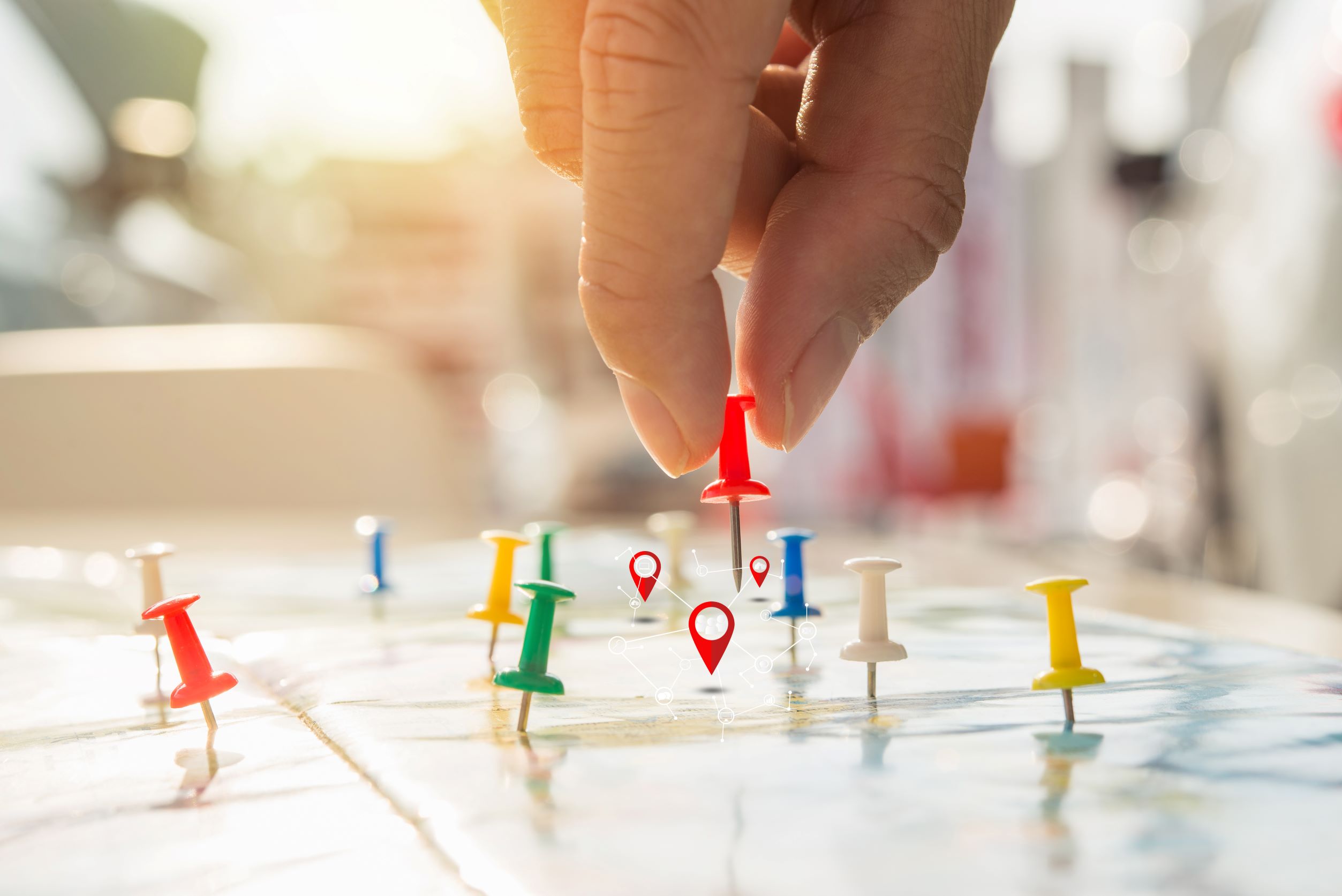Colorful pushpins on a map