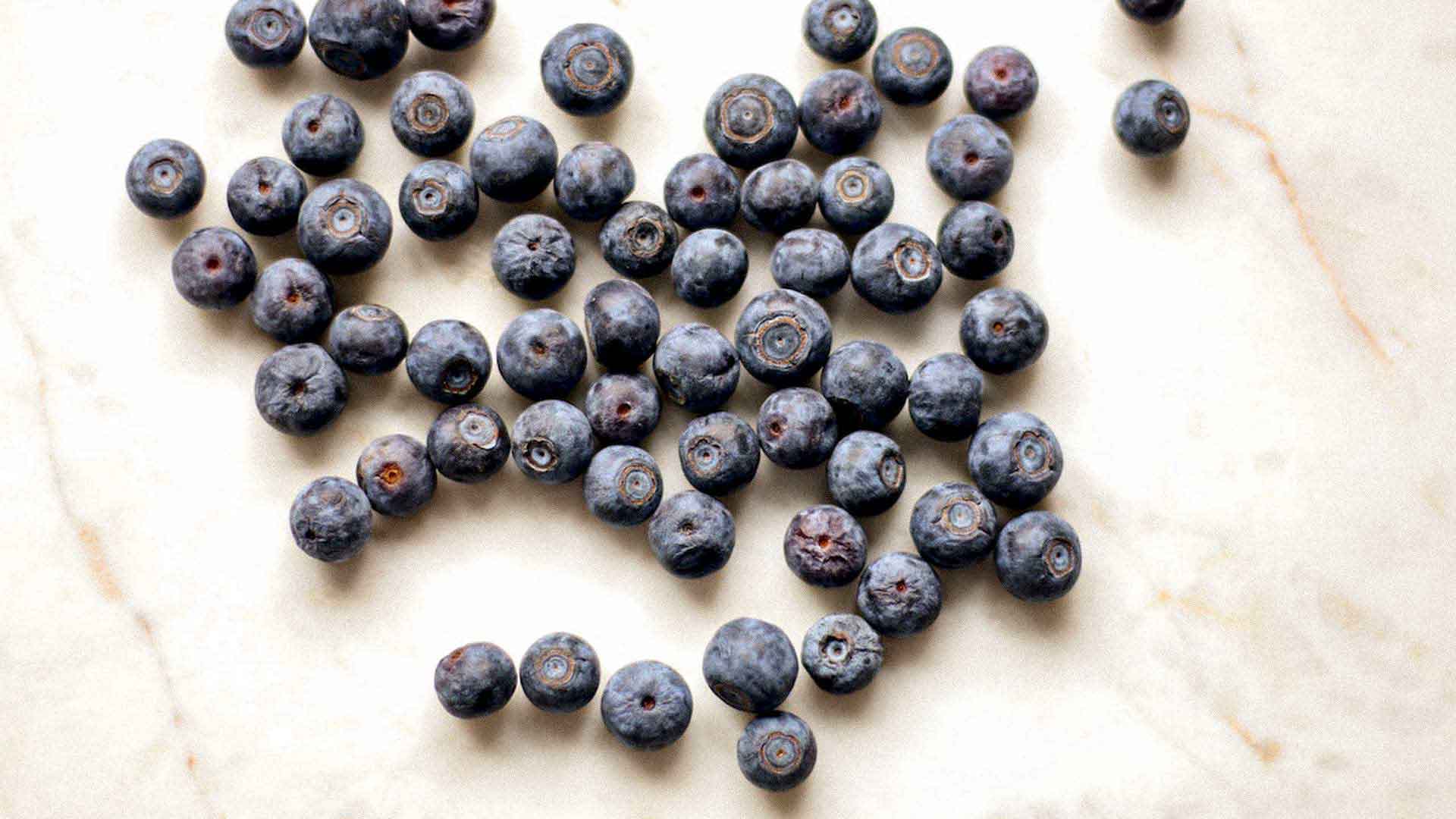 blueberries spread out on countertop