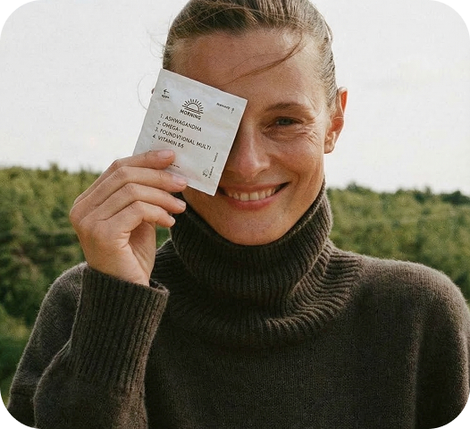 A girl smiling and holding persona packs