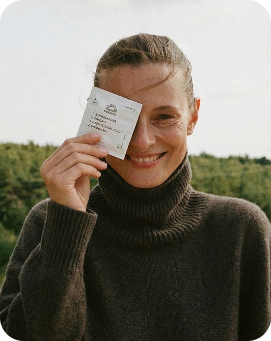 A girl smiling and holding persona packs