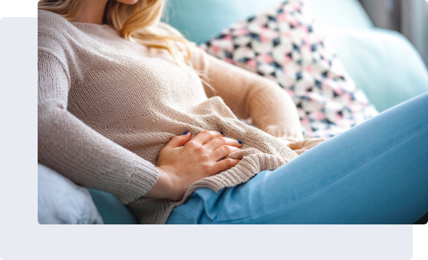 Person with hands over stomach